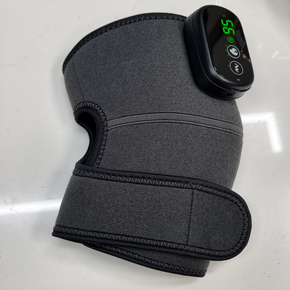 Knee Recovery Wrap fastened, with the display lit and showing the temperature