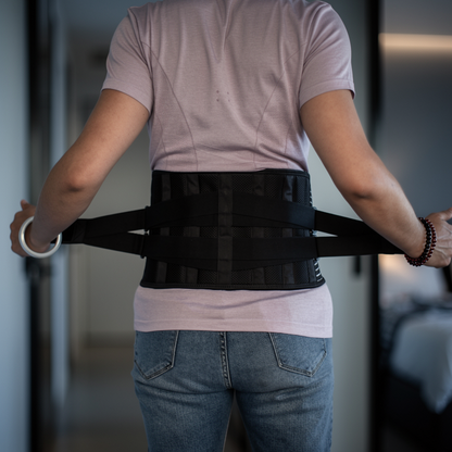 Lumbar Support Wrap worn across the lower back, seen from behind with both side straps drawn out