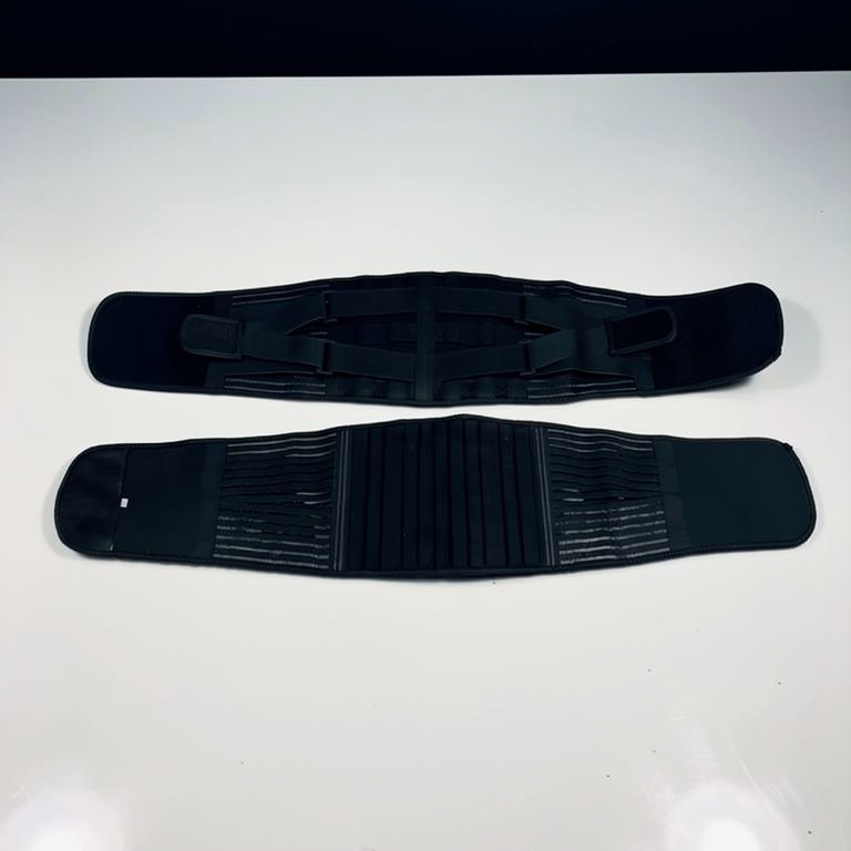 Lumbar Support Wrap laid open flat, showing the outer strap layer above and the ribbed inner panel below