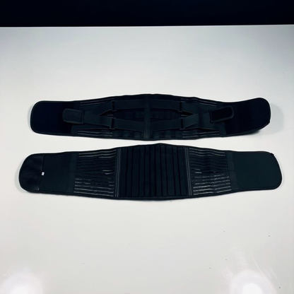 Lumbar Support Wrap laid open flat, showing the outer strap layer above and the ribbed inner panel below